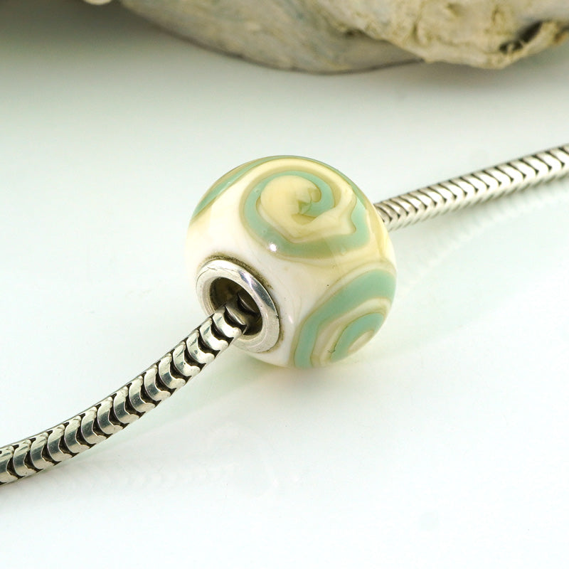 Aqua Swirls on Ivory Silver Cored Glass Charm Bead