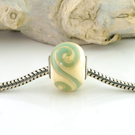 Aqua Swirls on Ivory Silver Cored Glass Charm Bead