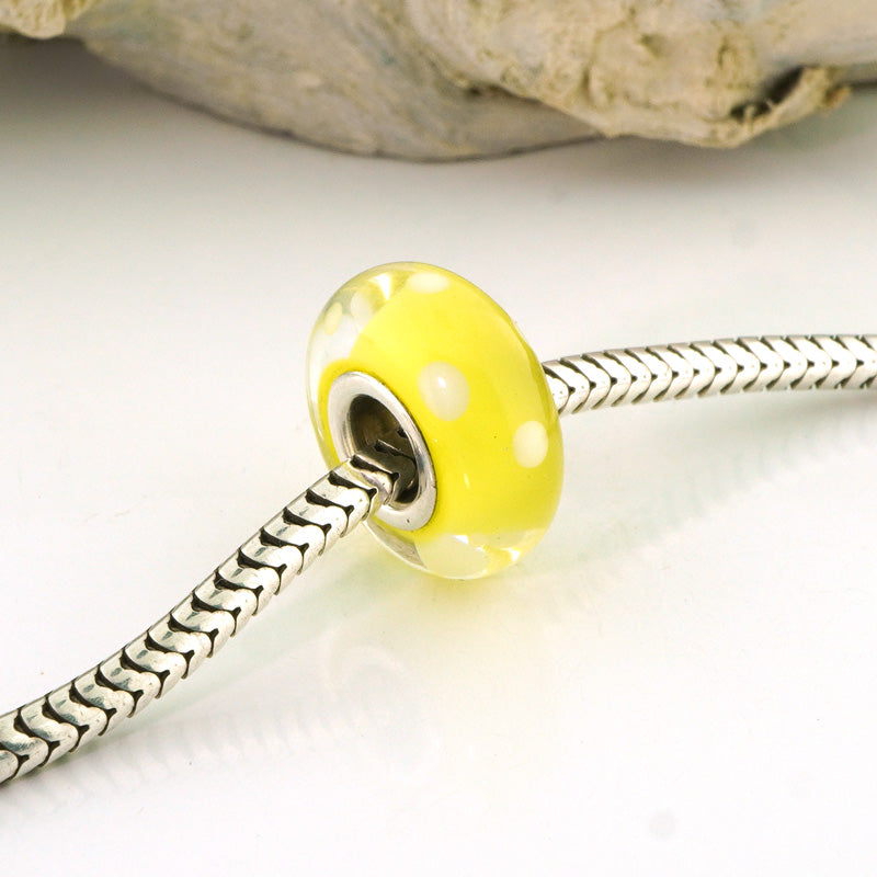 White Polka Dots on Transparent Yellow Silver Cored Glass Charm Bead