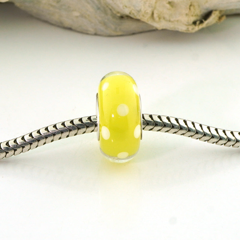 White Polka Dots on Transparent Yellow Silver Cored Glass Charm Bead